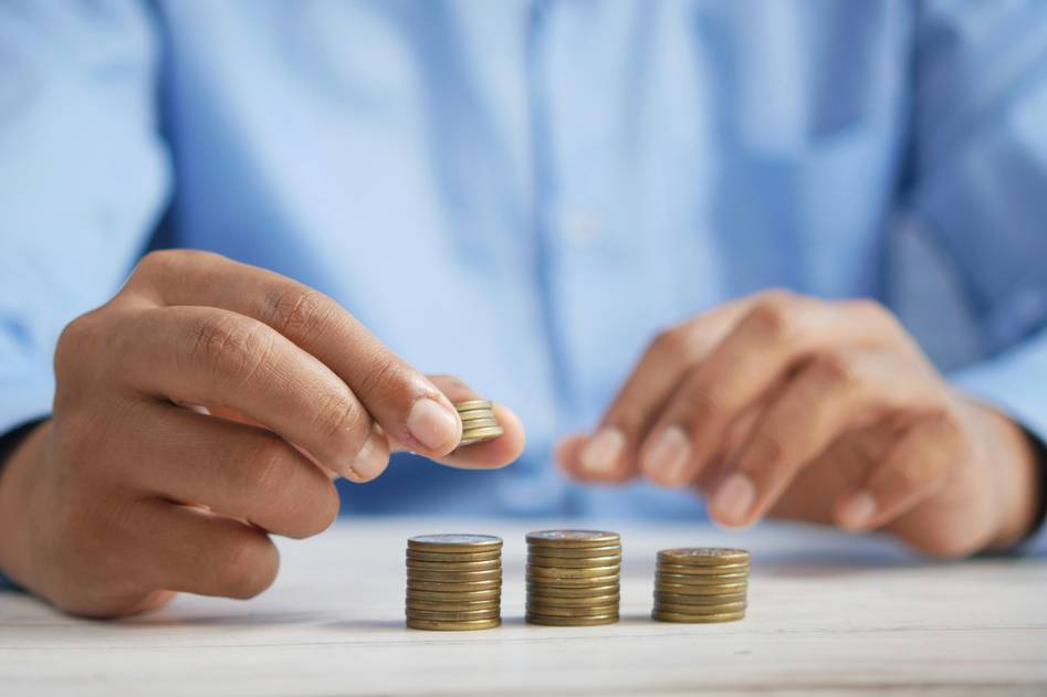 About section image of finance blog team discussing loan deferment topics