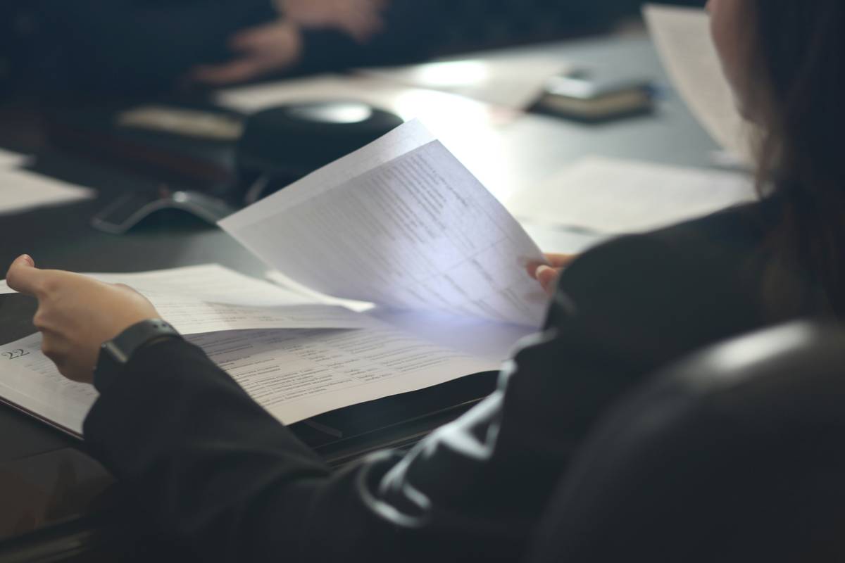 Checklist showing qualification guide standards for loan deferment including income proof, enrollment verification, and unemployment documentation